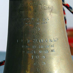 Close-up view of the inscription on the bugle.